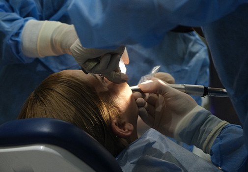 Woman getting oral surgery