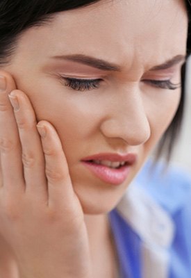 A woman with TMJ disorder near Winchester