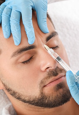 A man getting cosmetic injections near Winchester