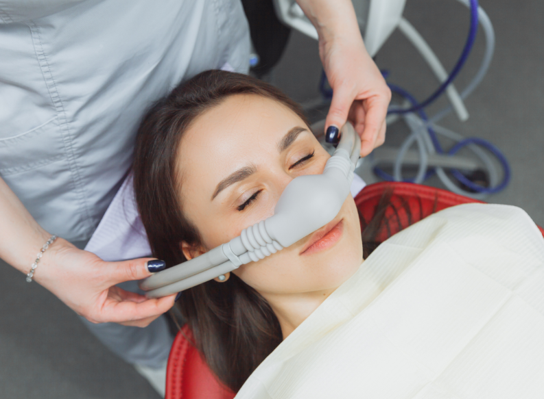 Woman undergoing dental sedation